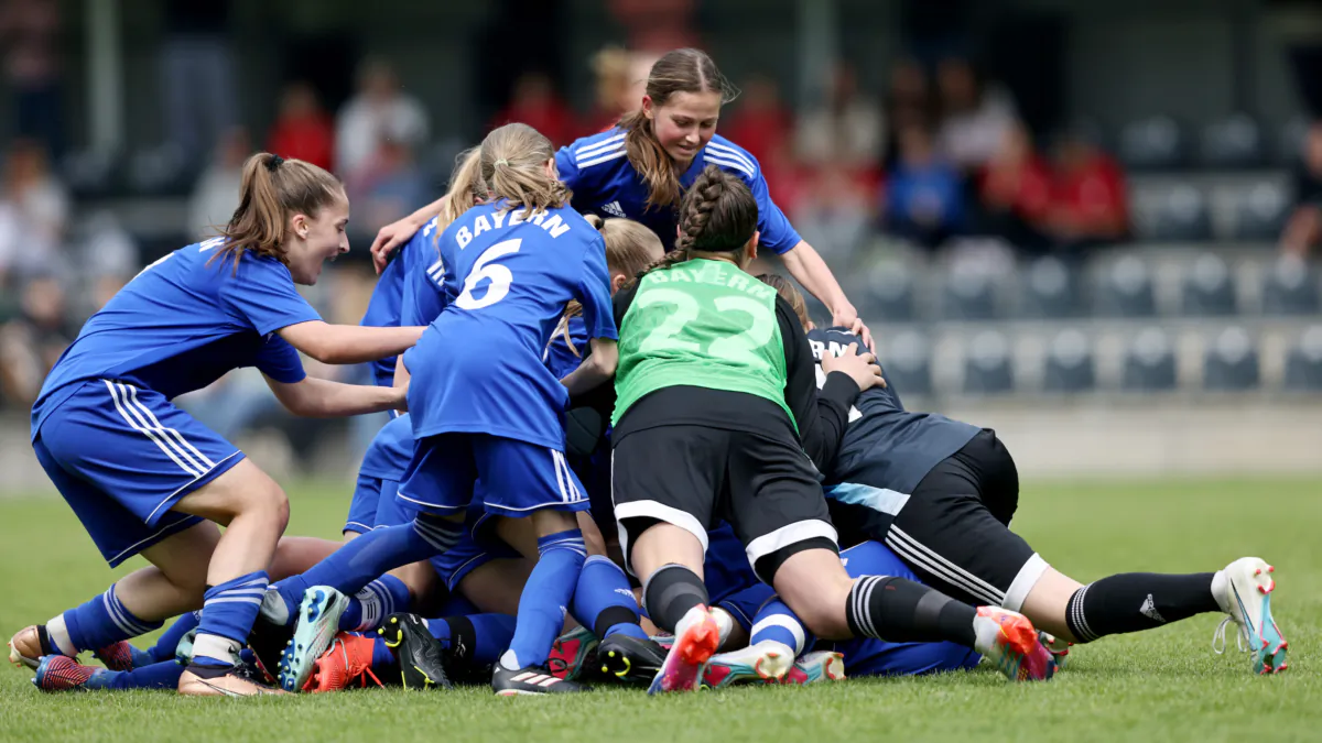 A team of U14 Junior Girls celebrate winning a match in Duisburg, Germany, on May 21, 2023. (Christof Koepsel/Getty Images for DFB)