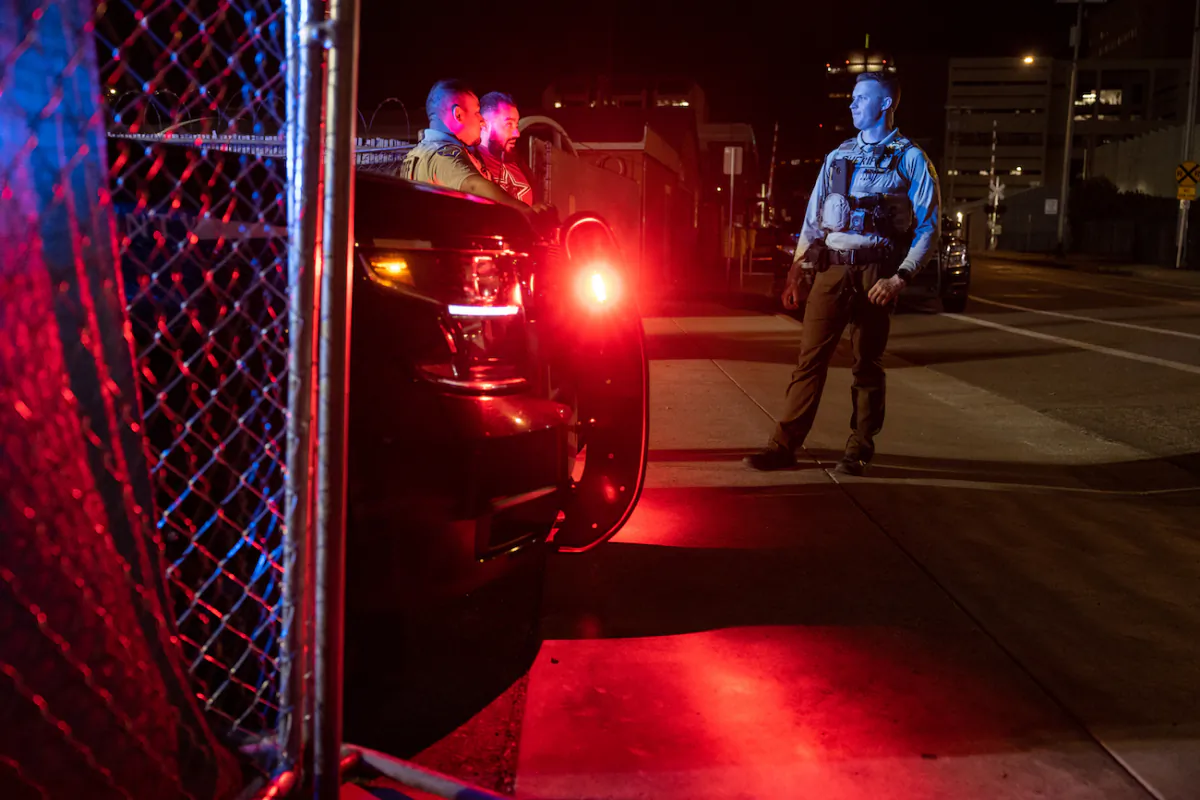 Law enforcement officers stand guard outside the Maricopa County Tabulation and Election Center in Phoenix on Nov. 8, 2022. (John Moore/Getty Images)