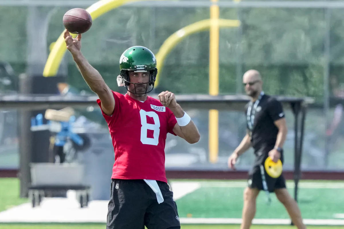 New York Jets quarterback Aaron Rodgers throws a pass during practice at the NFL football team's training facility in Florham Park, N.J., on July 21, 2023. (John Minchillo/AP Photo)