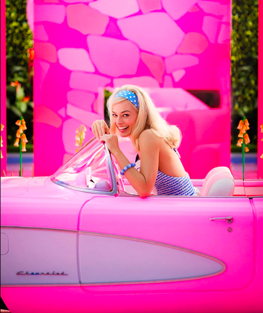 woman in pink car in BARBIE