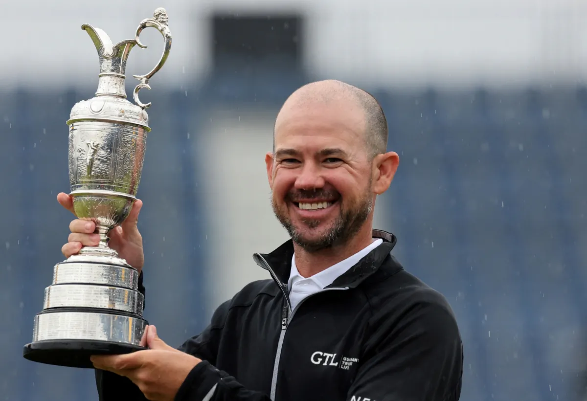 Brian Harman of the United States poses with the Claret Jug as he celebrates winning the 151st Open Championship at Royal Liverpool Golf Club in Hoylake, England, on July 23, 2023. (Lorraine Osullivan/Reuters)