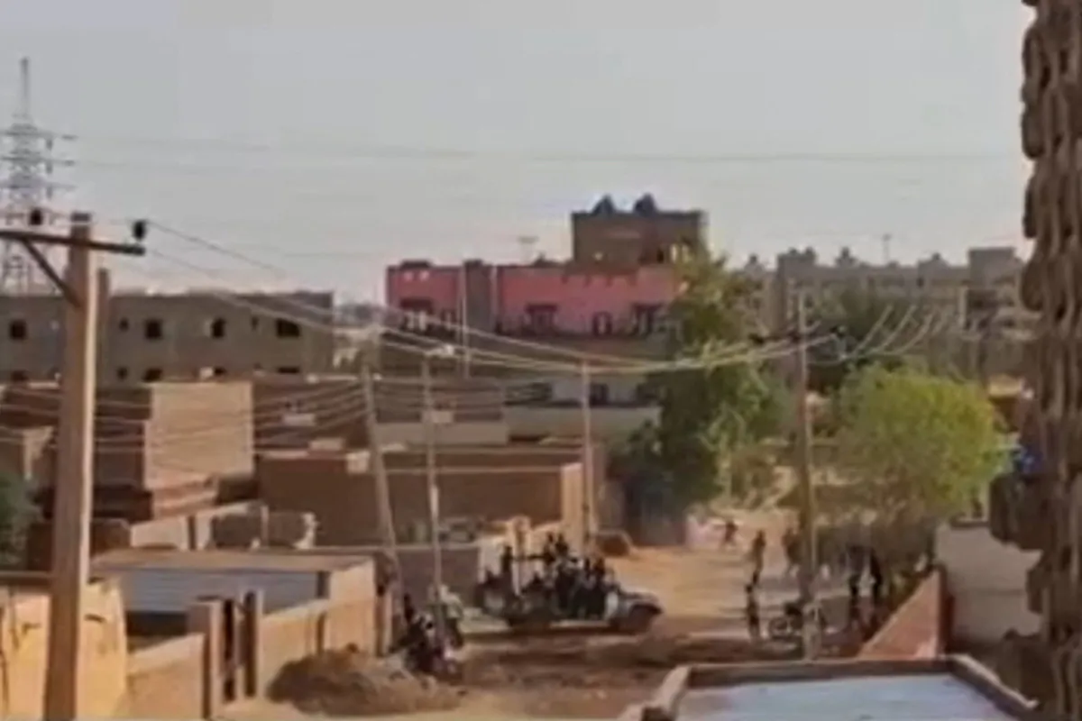 Sudanese armed forces are driving military vehicles through a street in Omdurman, Sudan, on July 13, 2023. (AFPTV/AFP via Getty Images)