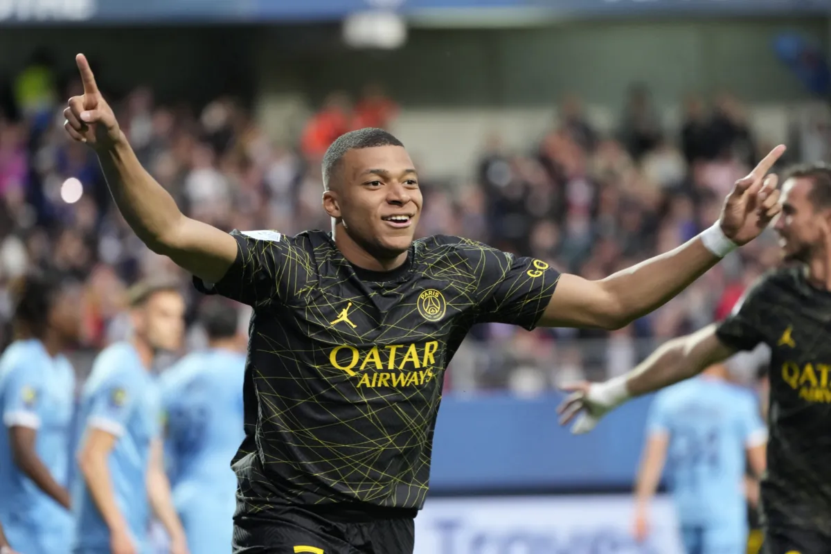 PSG's Kylian Mbappe celebrates after scoring his side's opening goal during the French League One soccer match between Troyes and Paris Saint Germain at the Stade de l'Aube in Troyes, France, on May 7, 2023. (Lewis Joly/AP Photo)