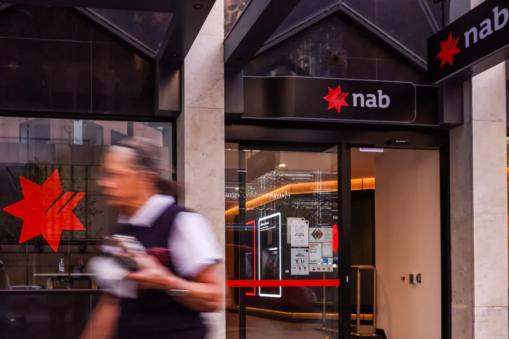 A person is seen walking past a NAB (National Australian Bank) branch in Melbourne, Australia, on May 3, 2022. (Asanka Ratnayake/Getty Images)