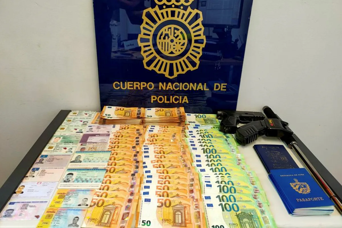 Seized money, weapons, and documents in a raid by Serbian police. (Serbian Ministry of Interior via AP)