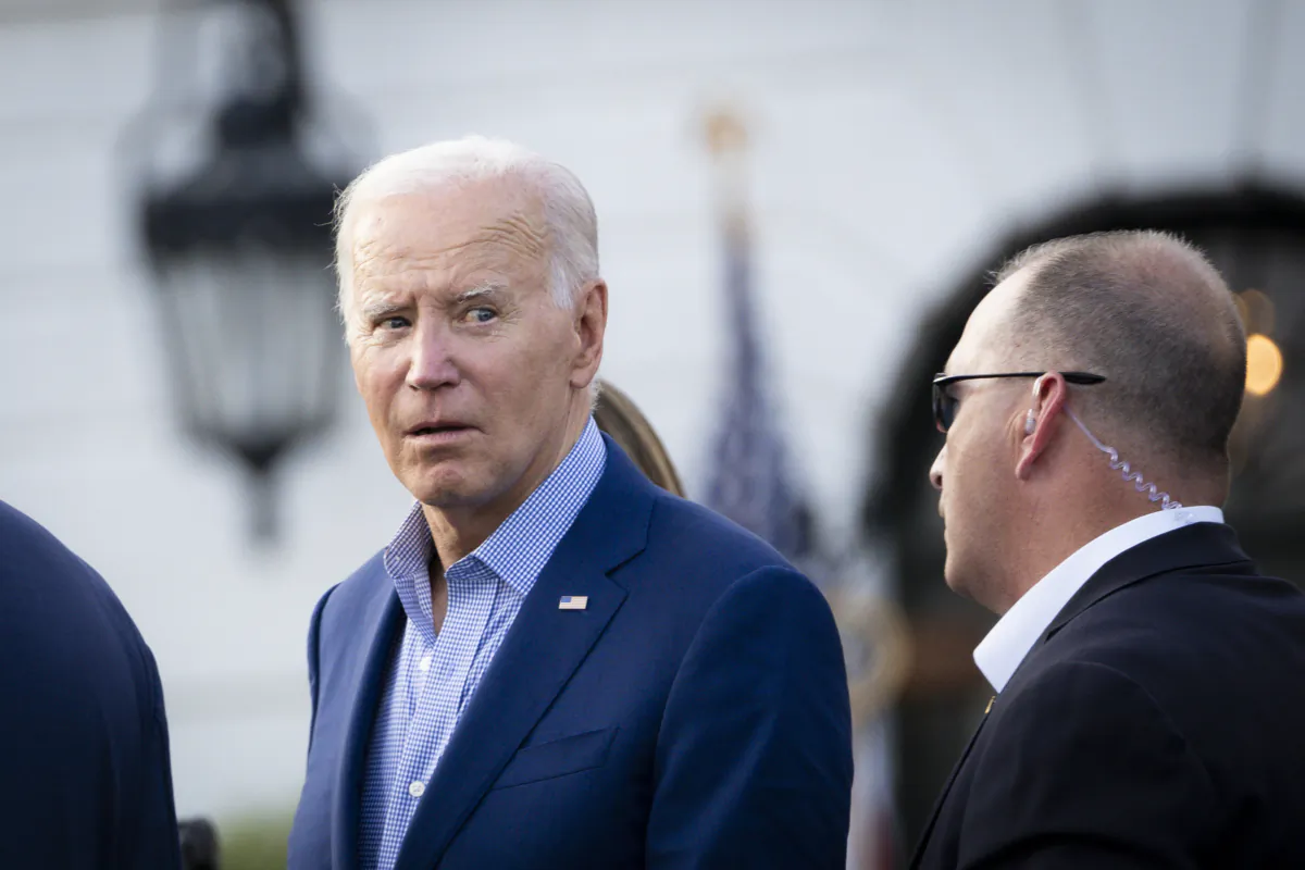 President Joe Biden greets lawmakers and their families during a Congressional picnic at the South Lawn of the White House in Washington on July 19, 2023. (Madalina Vasiliu/The Epoch Times)