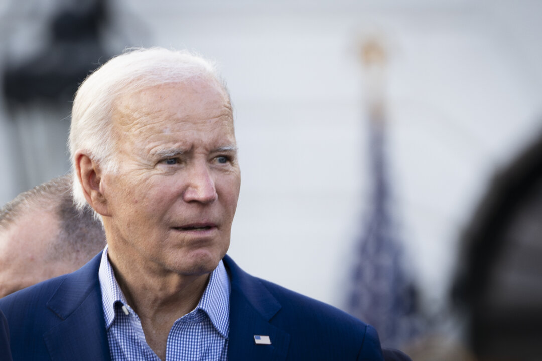 President Joe Biden greets lawmakers and their families during a Congressional picnic at the South Lawn of the White House in Washington on July 19, 2023. (Madalina Vasiliu/The Epoch Times)