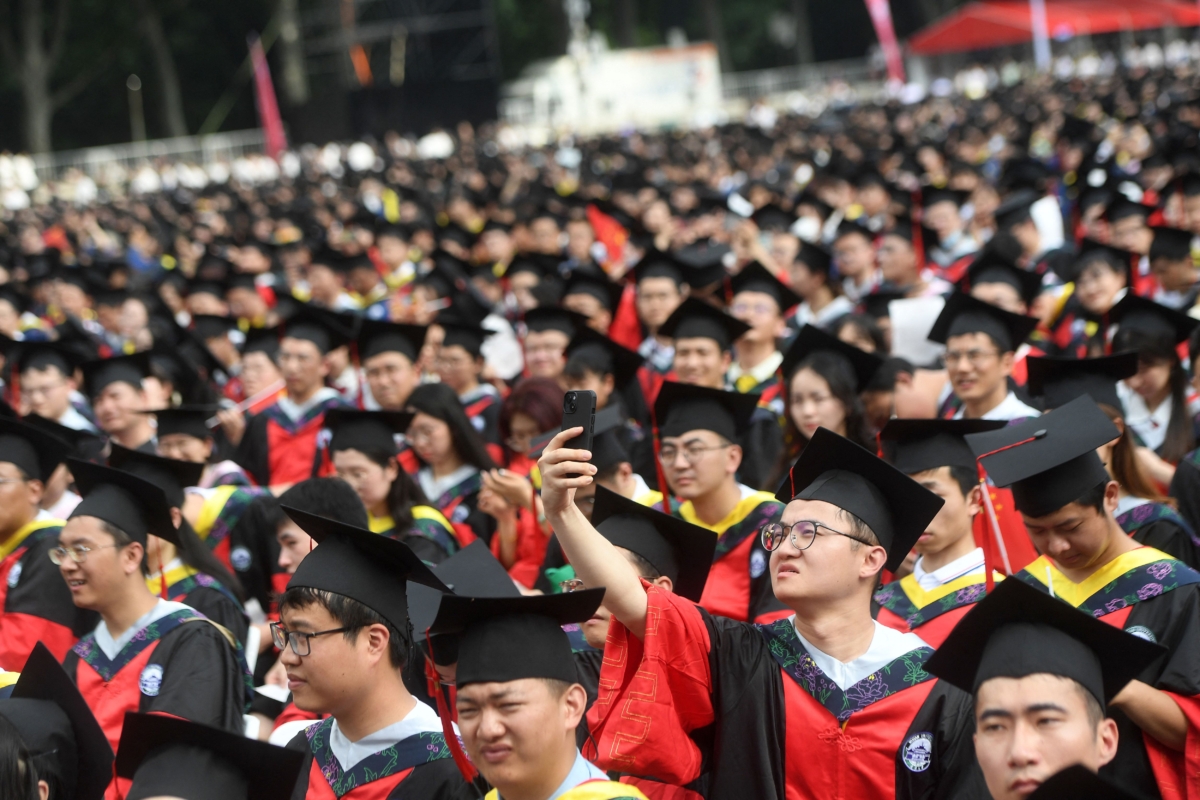 Graduates of Wuhan University attend the graduation ceremony in Wuhan, in China's central Hubei province on June 20, 2023. (STR/AFP via Getty Images)