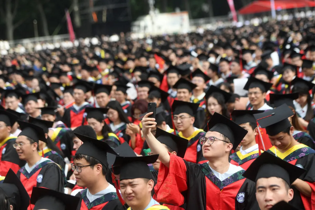 Graduates of Wuhan University attend the graduation ceremony in Wuhan, in China's central Hubei Province, on June 20, 2023. (STR/AFP via Getty Images)