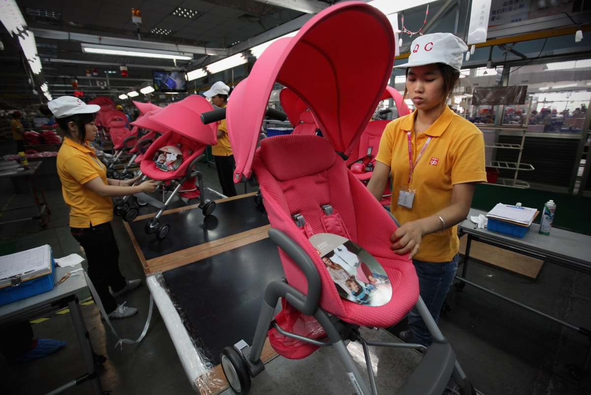 Workers assemble strollers at the production line of Goodbaby Group Co., Ltd. on July 6, 2012, in Kunshan of Jiangsu Province, China. (Feng Li/Getty Images)
