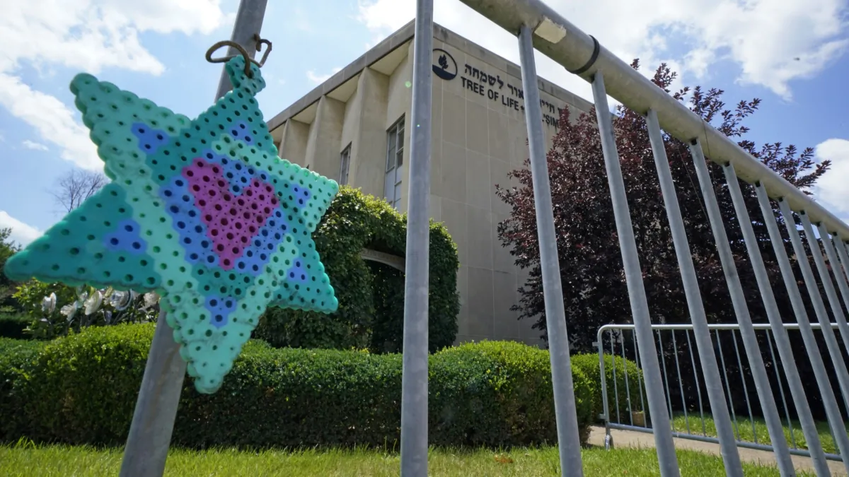 A Star of David hangs from a fence outside the dormant landmark Tree of Life synagogue in Pittsburgh's Squirrel Hill neighborhood on July 13, 2023. (Gene J. Puskar/AP Photo)