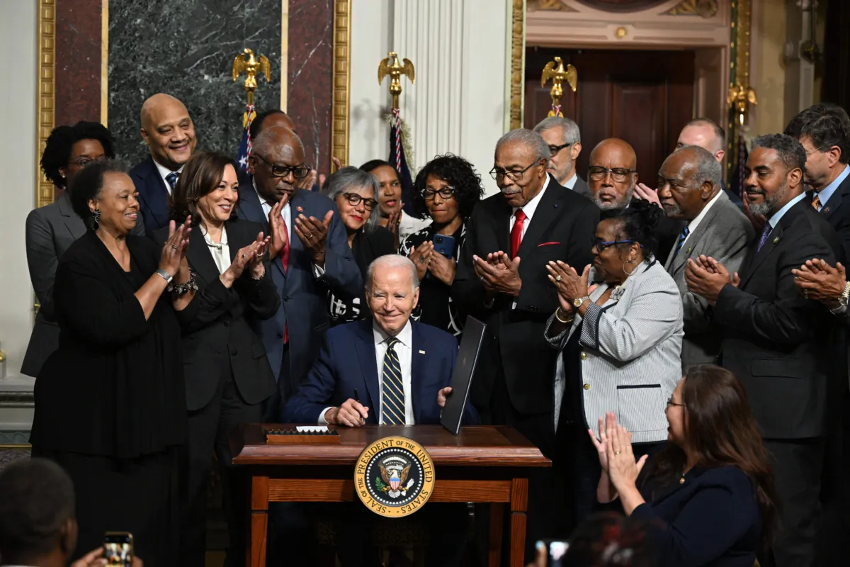 President Joe Biden signs a proclamation to establish the Emmett Till and Mamie Till-Mobley National Monument in Illinois and Mississippi, in the Indian Treaty Room of the Eisenhower Executive Office Building, next to the White House, in Washington,on July 23, 2023. (Mandel Ngan/AFP via Getty Images)