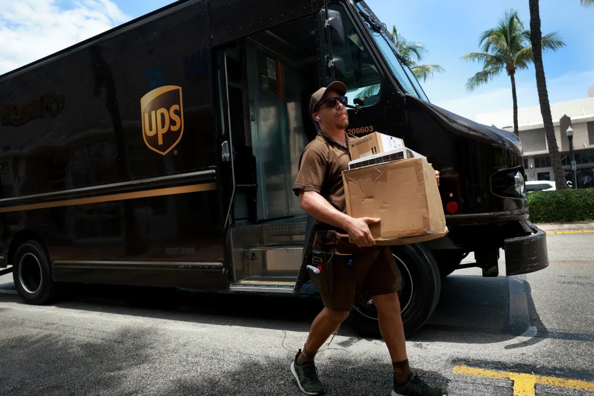A UPS driver makes a delivery in Miami on June 30, 2023. (Joe Raedle/Getty Images)