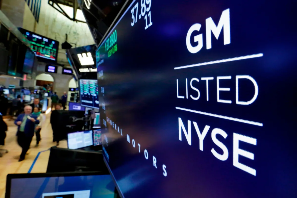 The logo for General Motors appears above a trading post on the floor of the New York Stock Exchange on April 23, 2018. (Richard Drew/AP Photo)