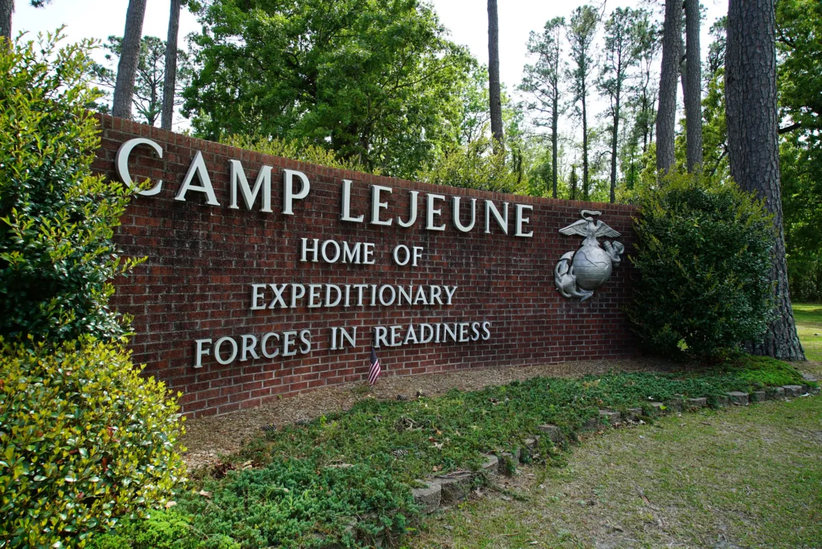 Signage stands on the main gate to Camp Lejeune Marine Base outside Jacksonville, N.C., on April 29, 2022. (Allen G. Breed/AP Photo)