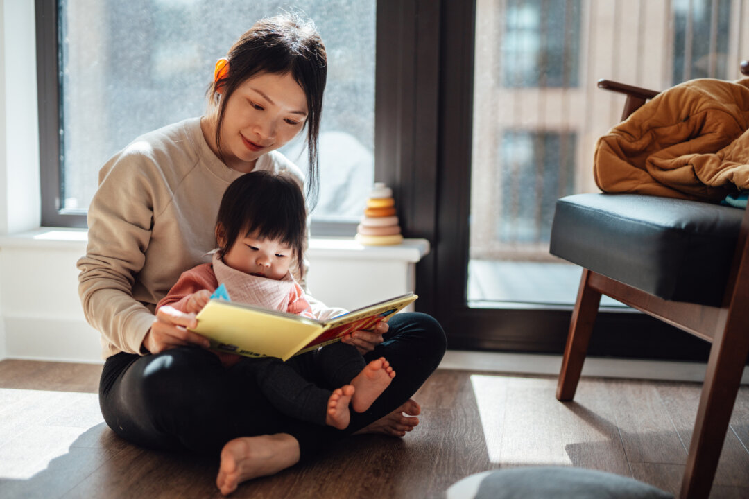 Reading out loud to children helps develop their language skills and prepares them to suceed in school. (Oscar Wong/Getty)