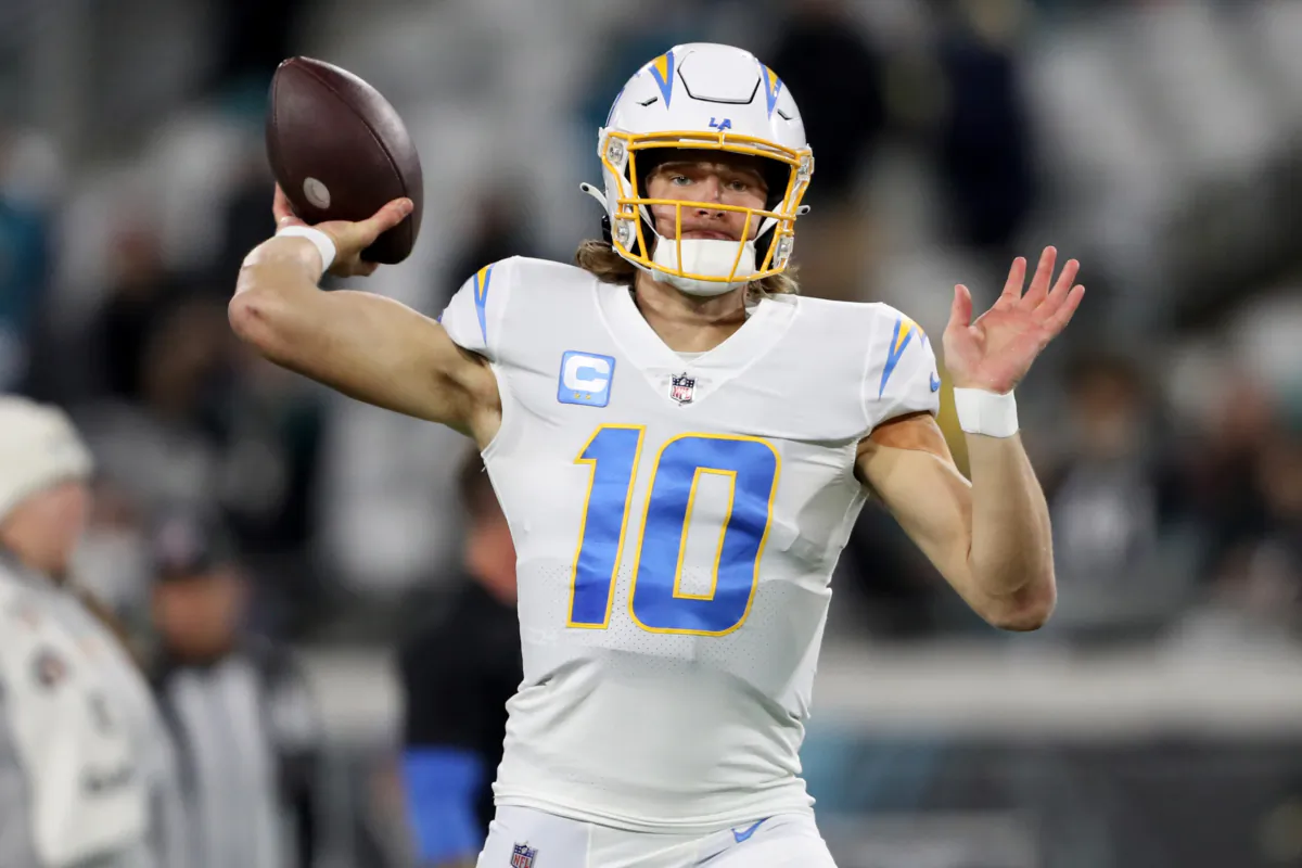 Justin Herbert (10) of the Los Angeles Chargers warms up prior to a game against the Jacksonville Jaguars in the AFC Wild Card playoff game at TIAA Bank Field in Jacksonville, Fla., on Jan. 14, 2023. (Courtney Culbreath/Getty Images)
