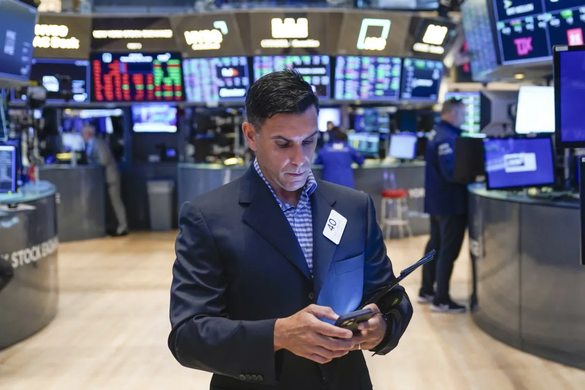 Traders work on the floor at the New York Stock Exchange in New York on July 26, 2023. (Seth Wenig/AP Photo)