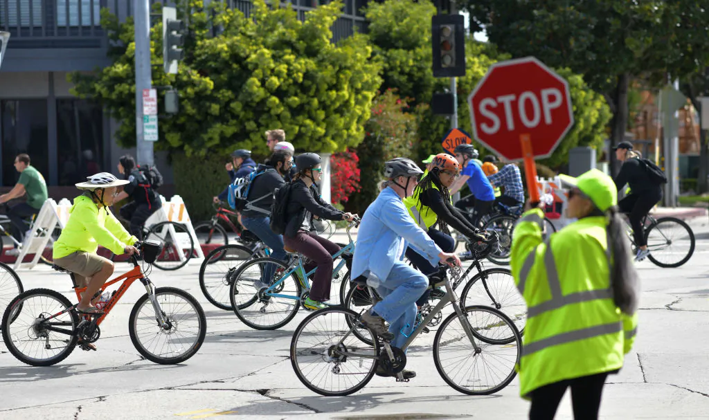 People ride bicycles in car-free streets during a CicLAvia event in Culver City, Calif., on March 3, 2019. (Chris Delmas/AFP via Getty Images)