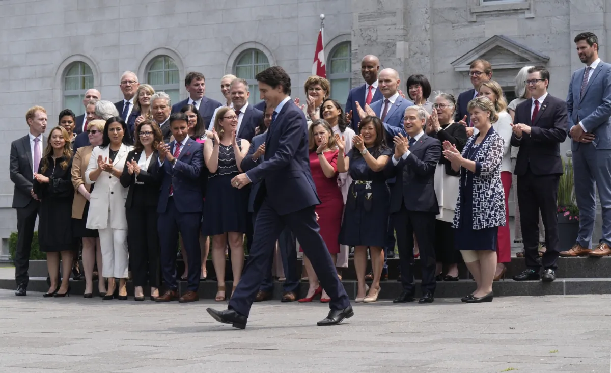 Prime Minister Justin Trudeau walks to a group photo opportunity with his new cabinet following a swearing-in ceremony at Rideau Hall in Ottawa on July 26, 2023. (The Canadian Press/Adrian Wyld)