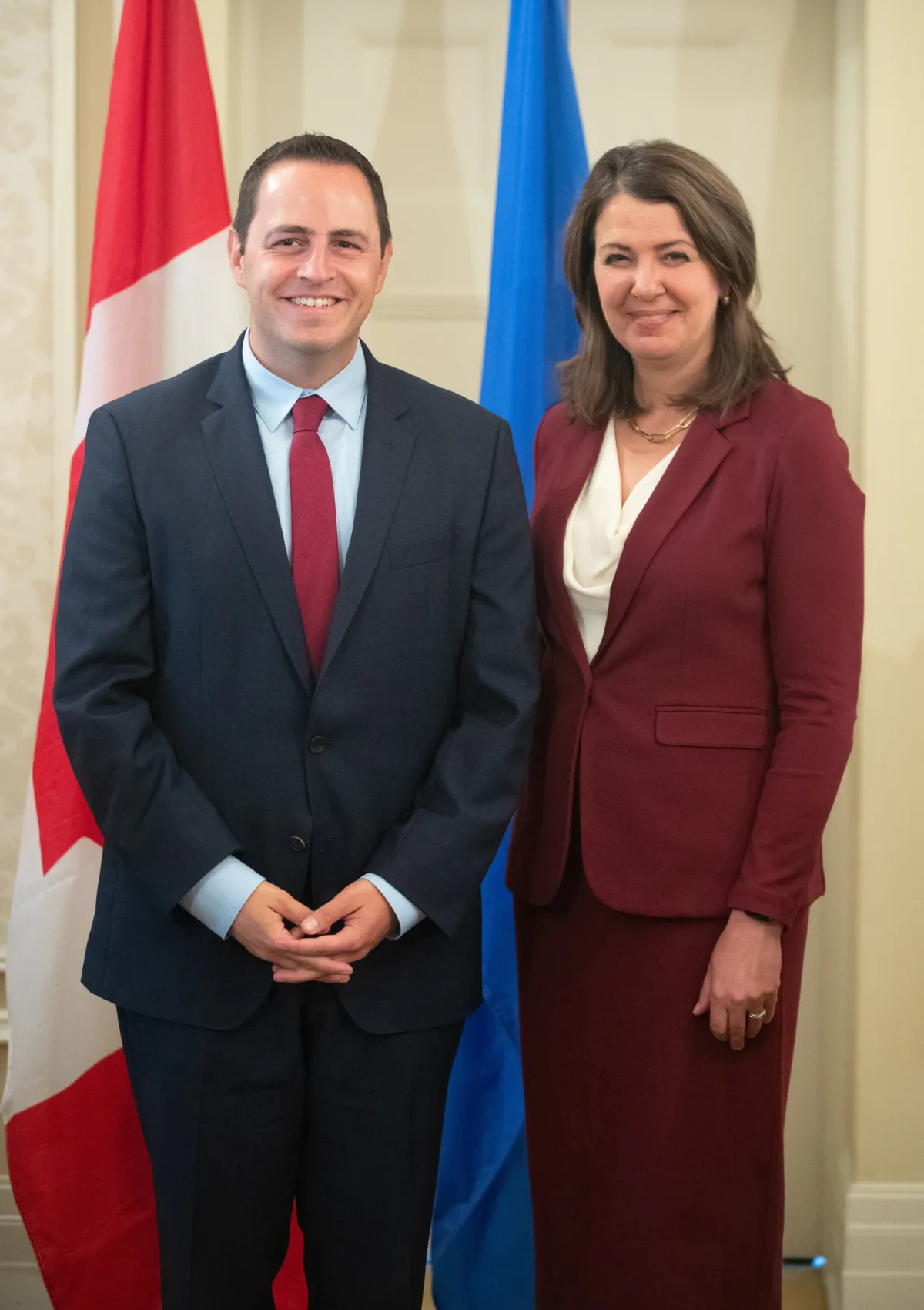 Alberta Premier Danielle Smith and Minister of Education Demetrios Nicolaides stand together during the swearing in of her cabinet in Edmonton, June 9, 2023. (Jason Franson/The Canadian Press)