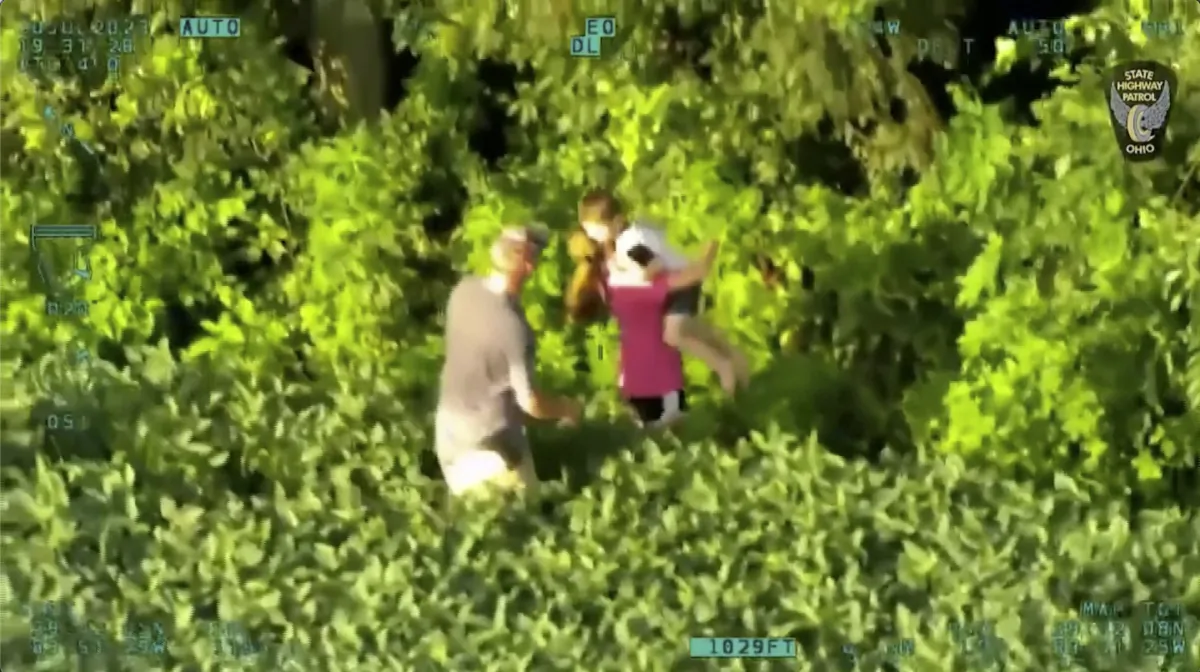 A 3-year-old child, who went missing for several hours, is reunited with his family in a field in Greene County, Ohio, on July 20, 2023. (Ohio State Highway Patrol via Reuters/Screenshot via NTD)