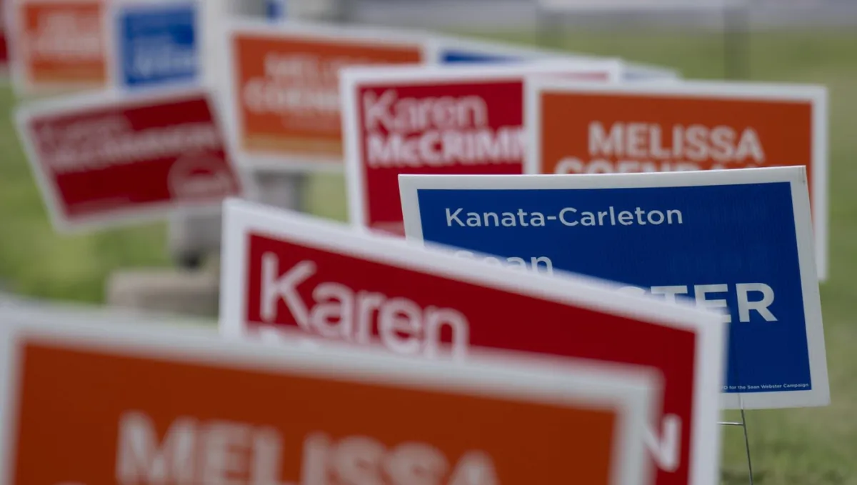 Campaign signs for provincial byelections in the riding of Kanata-Carleton are seen in Ottawa, on July 20, 2023. (The Canadian Press/Adrian Wyld)