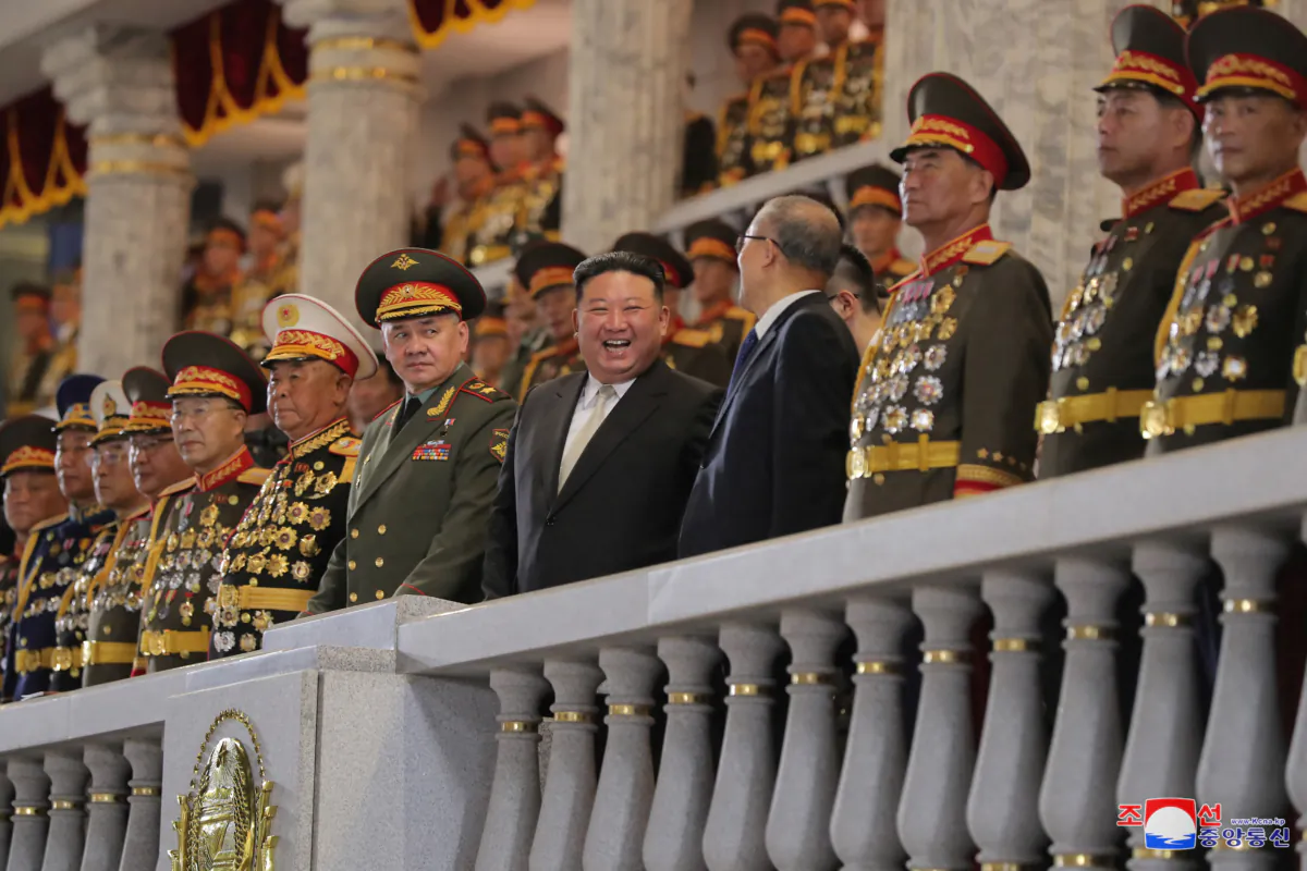 North Korean leader Kim Jong Un, Chinese Communist Party politburo member Li Hongzhong, and Russian Defense Minister Sergei Shoigu attend a military parade to commemorate the 70th anniversary of the Korean War armistice in Pyongyang, North Korea, on July 27, 2023. (KCNA via Reuters)