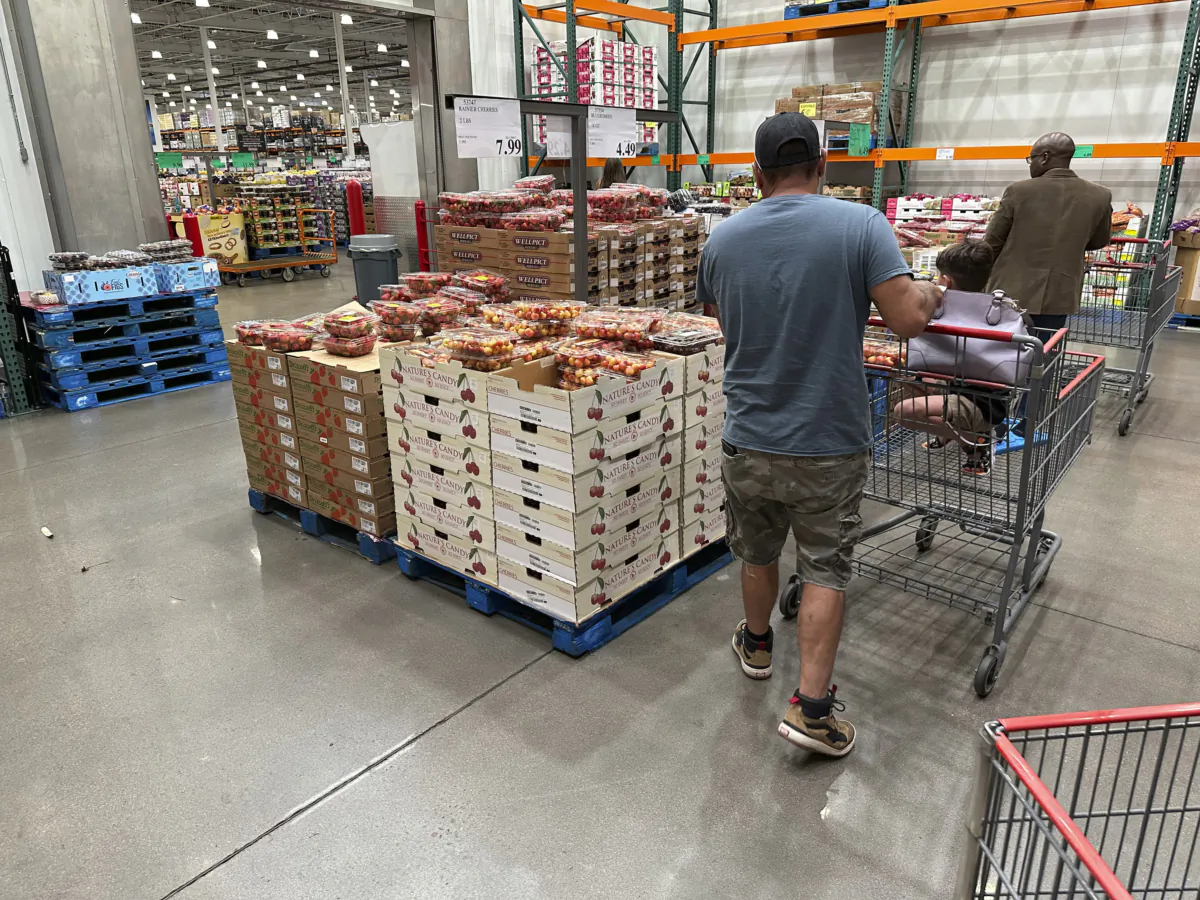 Shoppers peruse a display of Rainer cherries at a Costco warehouse in Sheridan, Colo., on July 11, 2023. (David Zalubowski/AP Photo)