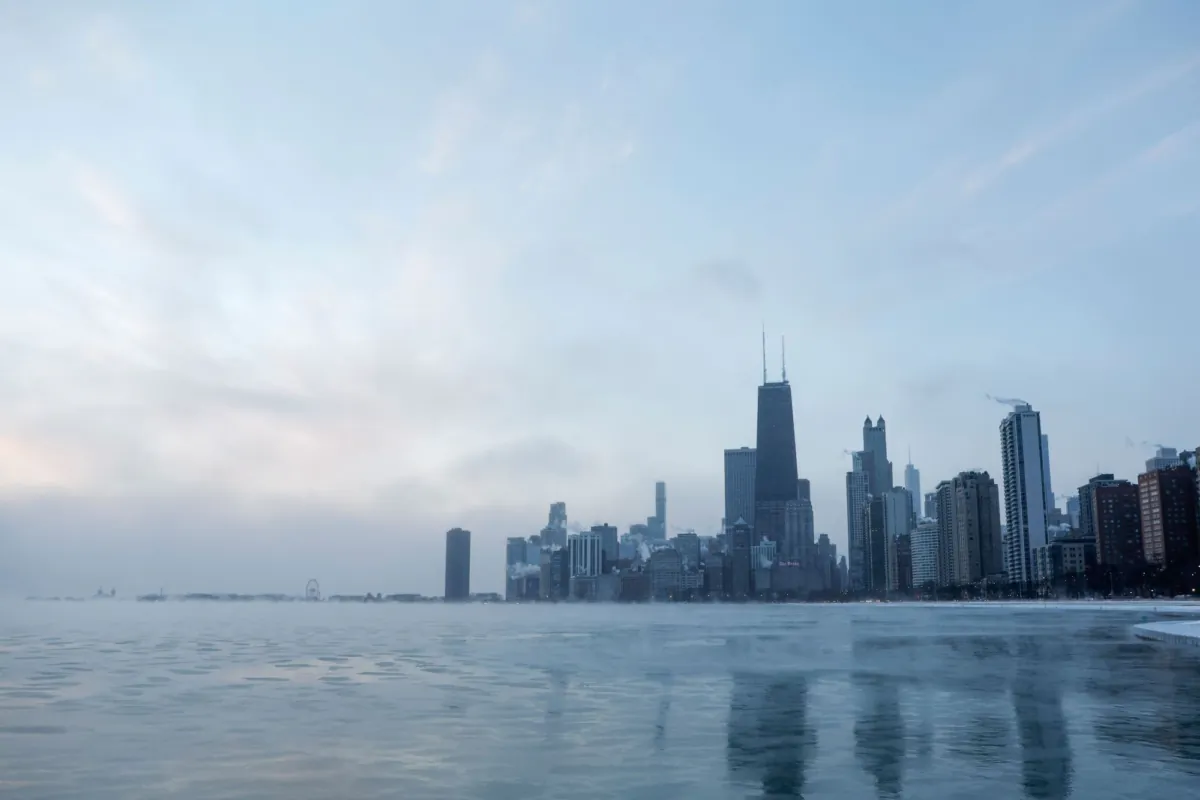 Mist rises from Chicago and Lake Michigan at sunrise on Dec. 23, 2022. (Kamil Krzaczynski/AFP via Getty Images)