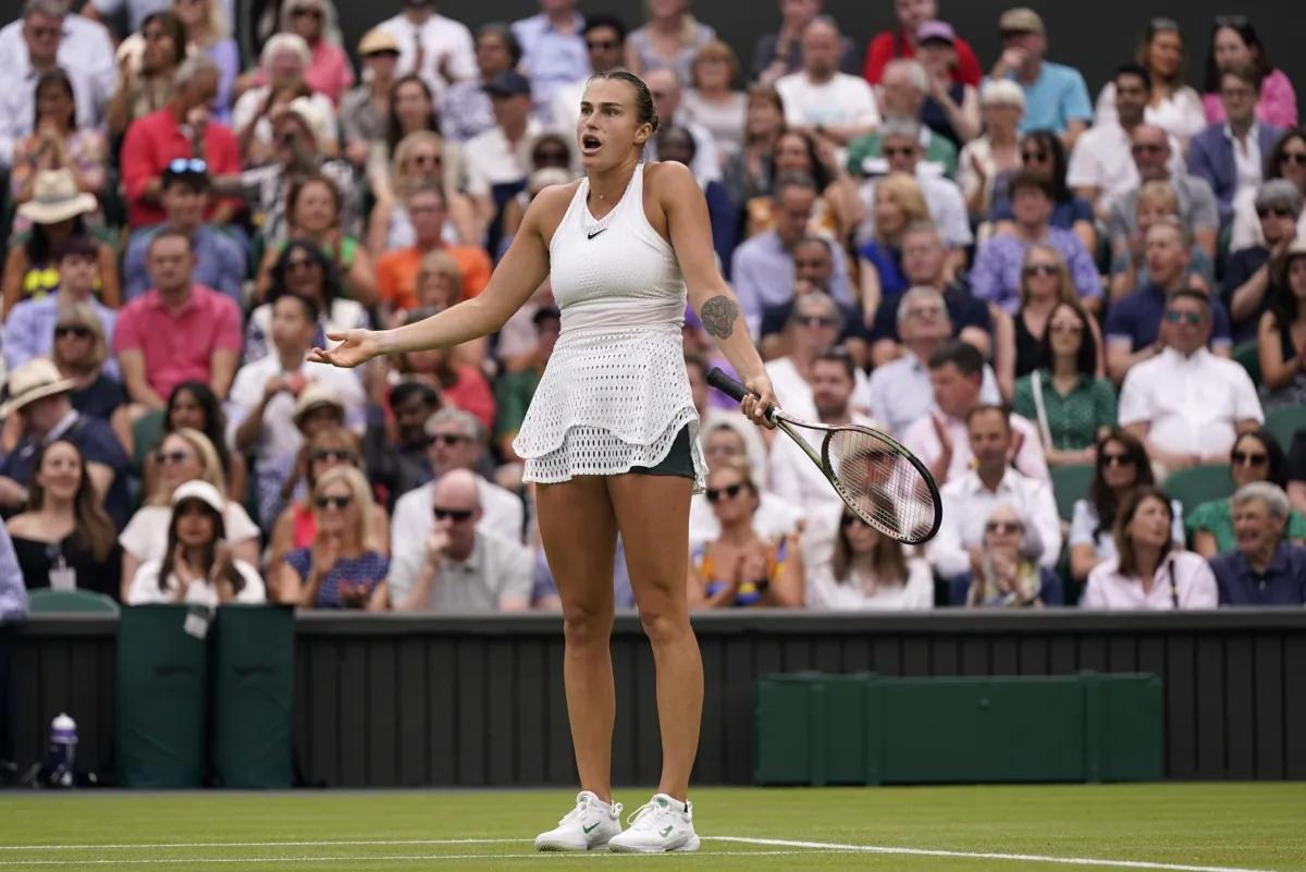 Aryna Sabalenka of Belarus reacts as she plays Tunisia's Ons Jabeur in a women's singles semifinal match on day eleven of the Wimbledon tennis championships in London on July 13, 2023. (Alberto Pezzali/AP Photo)