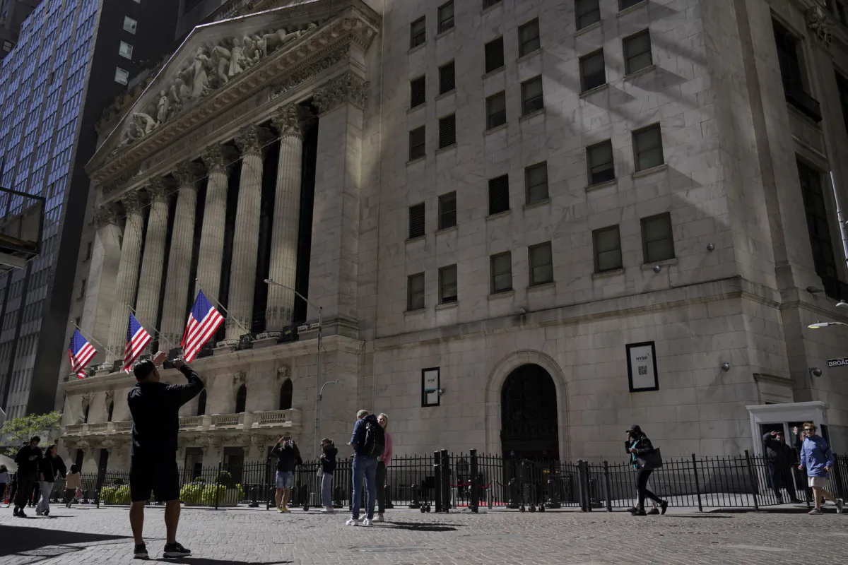 A visitor takes a photo of the New York Stock Exchange in New York on Sept. 23, 2022. (Mary Altaffer/AP Photo)