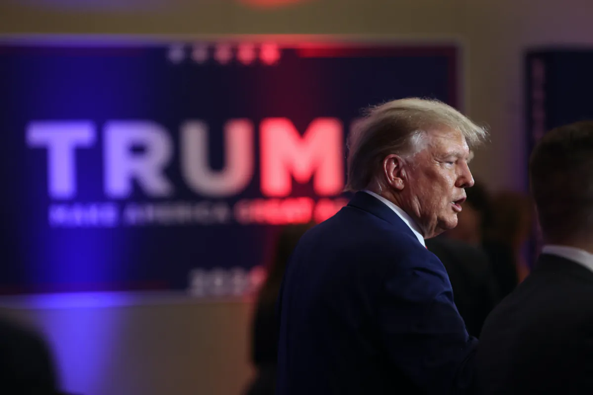 Republican presidential candidate former President Donald Trump greets guests at the Republican Party of Iowa 2023 Lincoln Dinner in Des Moines, Iowa, on July 28, 2023. (Scott Olson/Getty Images)