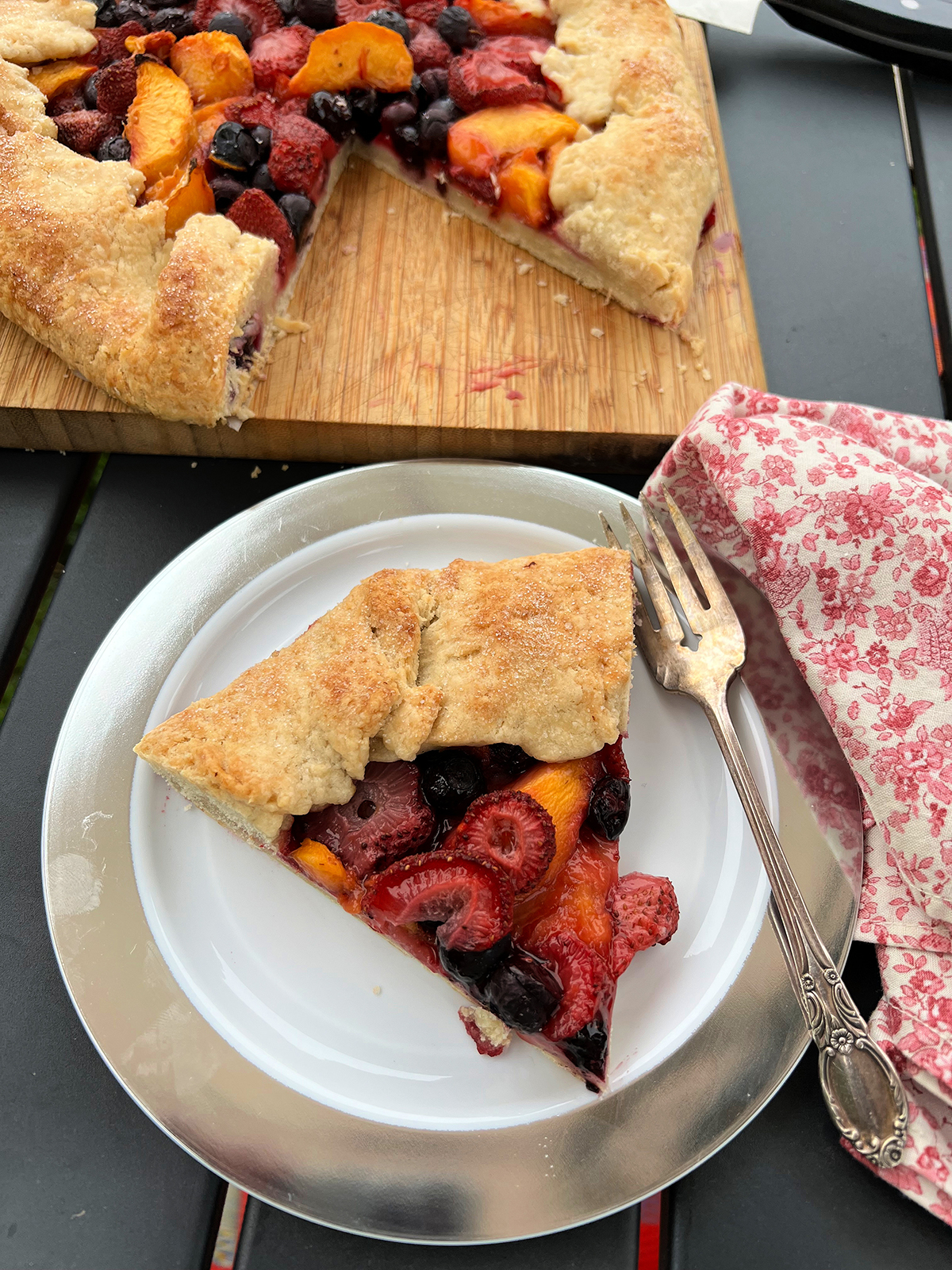A slice of peach, strawberry and blueberry galette for dessert speaks to the season. 