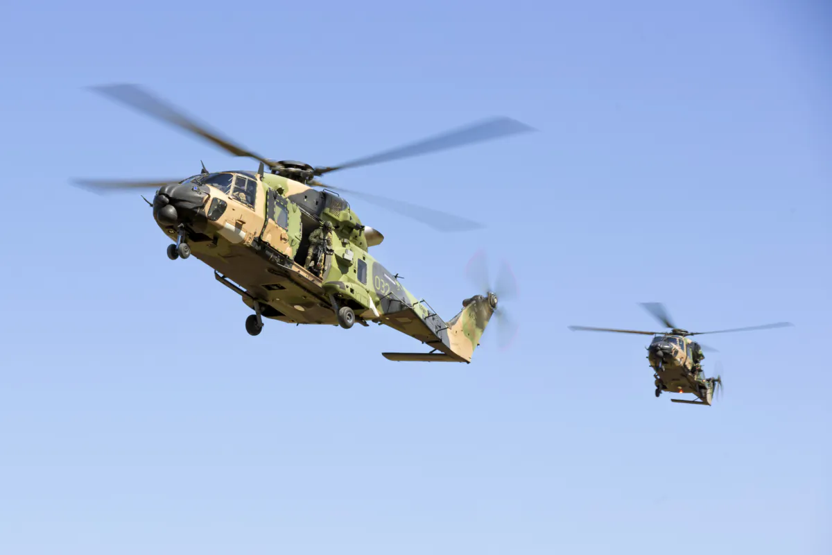 Australian Army MRH-90 Taipan helicopters prepare to land at Townsville, during Exercise Brolga Run 23, in Australia, in May 10, 2023. (LCPL Riley Blennerhassett/ADF via AP)