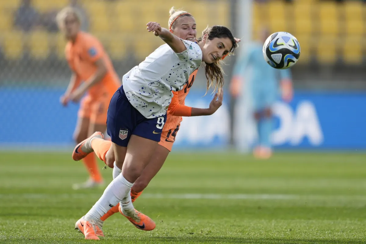 United States' Savannah DeMelo (front) and Netherlands' Jackie Groenen battle for possession during the first half of the FIFA Women's World Cup Group E soccer match between the United States and the Netherlands in Wellington, New Zealand, on July 27, 2023. (John Cowpland/AP Photo)