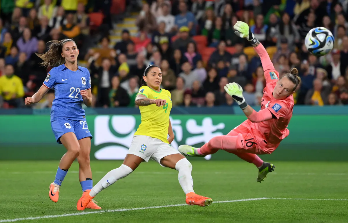 Debinha of Brazil scores her team's first goal past Pauline Peyraud-Magnin of France during the FIFA Women's World Cup Australia & New Zealand 2023 Group F match between France and Brazil at Brisbane Stadium in Brisbane, Australia, on July 29, 2023. (Justin Setterfield/Getty Images)