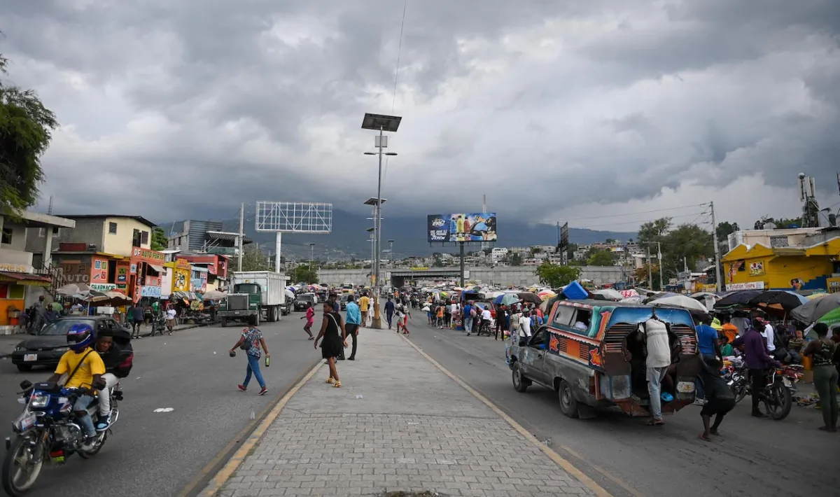 People walk past a street market in Port-au-Prince, Haiti, on June 28, 2023. (Richard Pierrin/AFP via Getty Images)