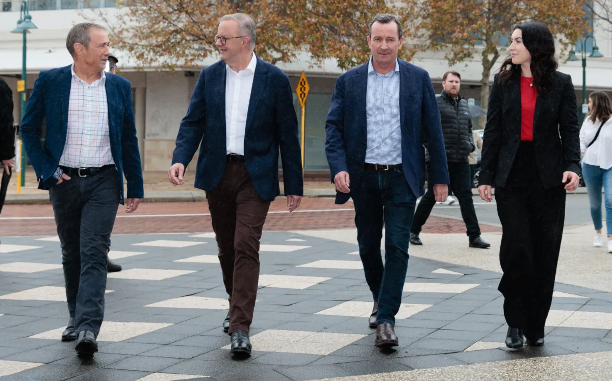 Prime Minister Anthony Albanese (second left) is seen walking with WA Premier Roger Cook (left), former WA Premier Mark McGowan, and Labor candidate for Rockingham Magenta Marshall (right) during a walk around Rockingham centre in Rockingham, south of Perth, Australia, on July 8, 2023. (AAP Image/Richard Wainwright)