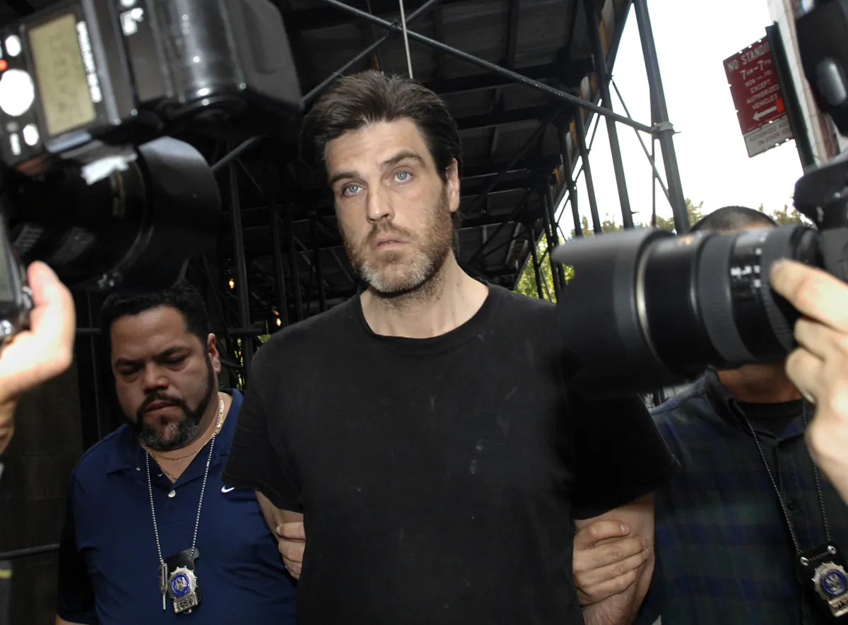 Robert Chambers is led in handcuffs into Manhattan criminal court for his arraignment in New York on Oct. 23, 2007. (Louis Lanzano/AP Photo)
