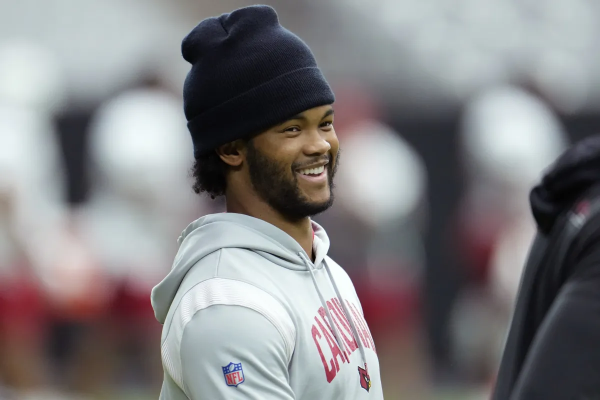 Injured Arizona Cardinals quarterback Kyler Murray smiles as he talks with teammates during NFL football training camp practice at State Farm Stadium in Glendale, Ariz., on July 28, 2023. (Ross D. Franklin/AP Photo)