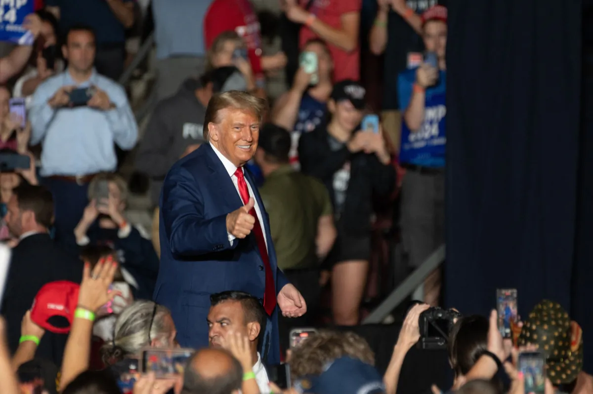 Former President Donald Trump gives a thumbs up as he leaves after speaking at a campaign rally in Erie, Pa., on July 29, 2023. (Joed Viera/AFP via Getty Images)