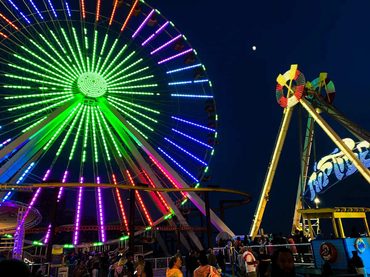 The boardwalk comes alive at night with the bright and shimmering lights from the carnival rides at Morey’s Pier. (Courtesy of Lynn Topel)