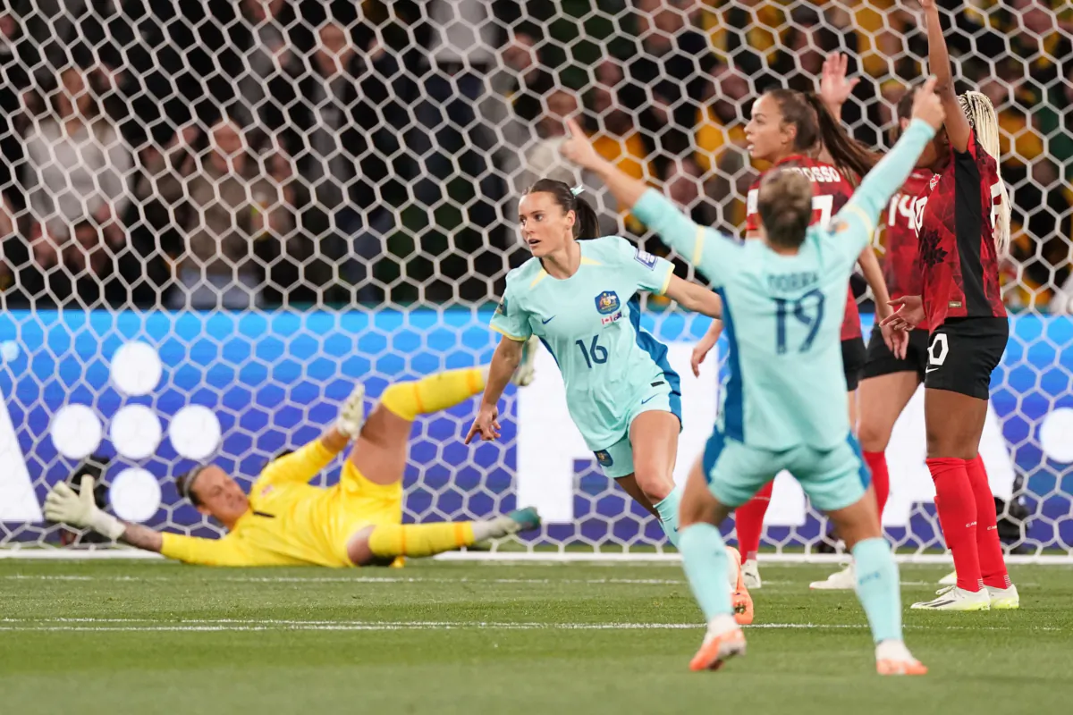 Hayley Raso (16) of Australia celebrates after scoring the first goal past Canada's keeper Kailen Sheridan during Group B soccer action at the FIFA Women's World Cup in Melbourne, Australia, on July 31, 2023. (The Canadian Press/Scott Barbour)