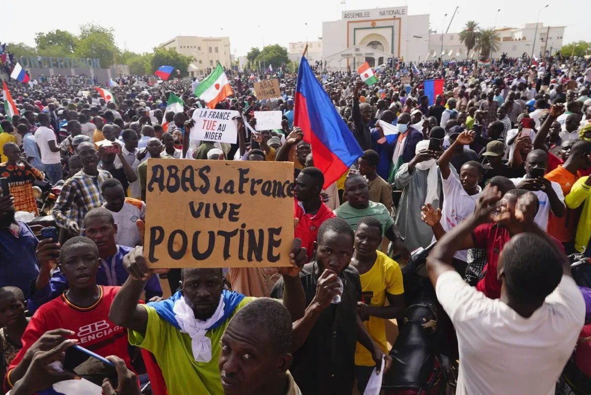 Nigeriens participate in a march called by supporters of coup leader Gen. Abdourahmane Tchiani in Niamey, Niger, on July 30, 2023. (Sam Mednick/The Canadian Press/AP)