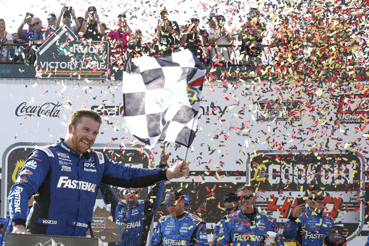 Chris Buescher, driver of the (17) Fastenal Ford, celebrates with the checkered in victory lane after winning the NASCAR Cup Series Cook Out 400 at Richmond Raceway in Richmond, Virginia, on July 30, 2023. (Sean Gardner/Getty Images)