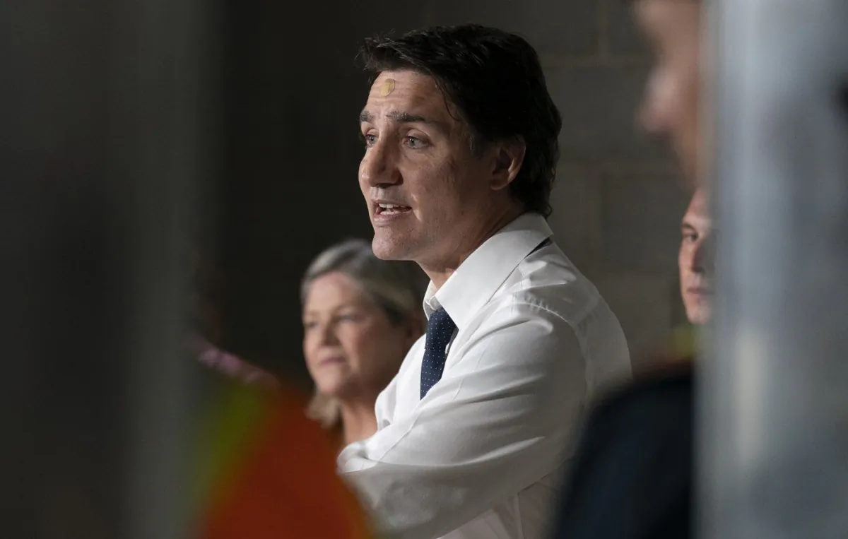 Prime Minister Justin Trudeau speaks during a visit to an apartment complex under construction in Hamilton, Ontario, July 31, 2023. (The Canadian Press/Peter Power)