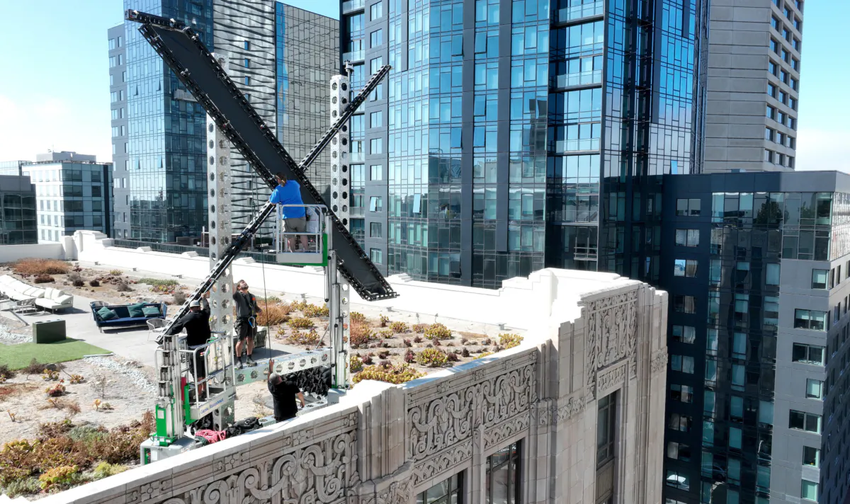 Workers start to dismantle a large X logo on the roof of X headquarters in San Francisco on July 31, 2023. (Justin Sullivan/Getty Images)