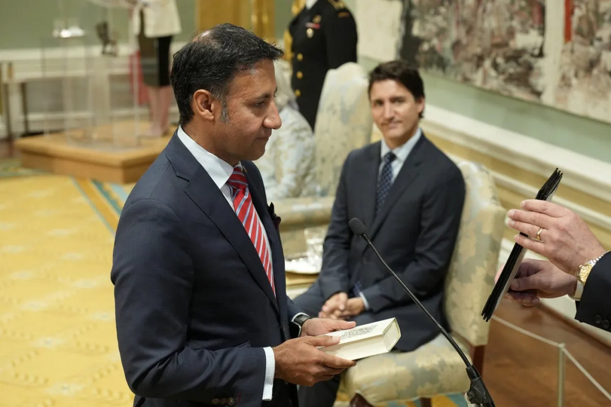 Minister of Justice and Attorney General of Canada Arif Virani takes the oath of office as Prime Minister Justin Trudeau looks on during a cabinet swearing-in ceremony at Rideau Hall in Ottawa, July 26, 2023. (The Canadian Press/Adrian Wyld)
