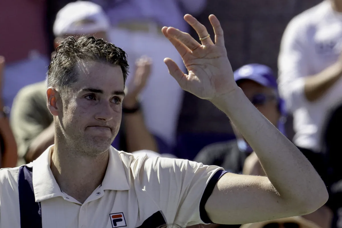 USA's John Isner waves after losing against USA's Michael Mmoh during the US Open tennis tournament men's singles second round match at the USTA Billie Jean King National Tennis Center in New York City, on August 31, 2023. (Kena Betancur/AFP via Getty Images)